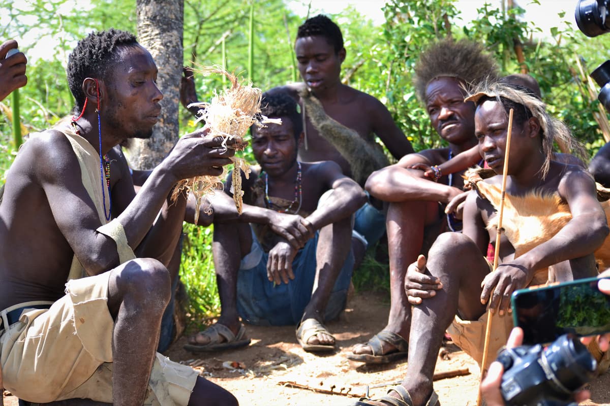 A Hadza man starting a fire near Lake Eyasi